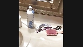 Clean shaved twat gets fucked in bathroom